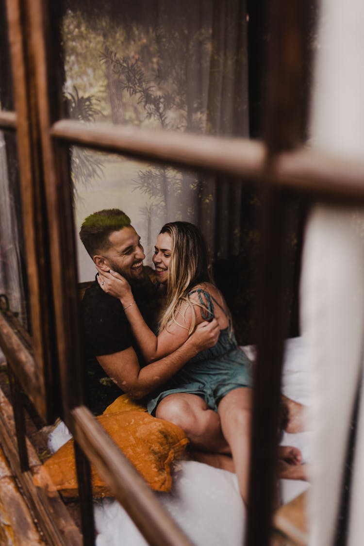 Photo Of A Happy Couple Sitting Together