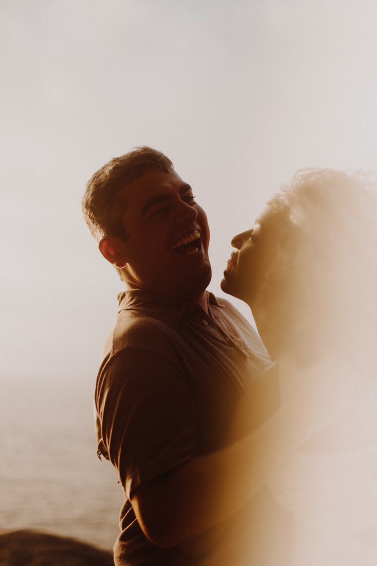 Close Up Photo Of Couple Laughing