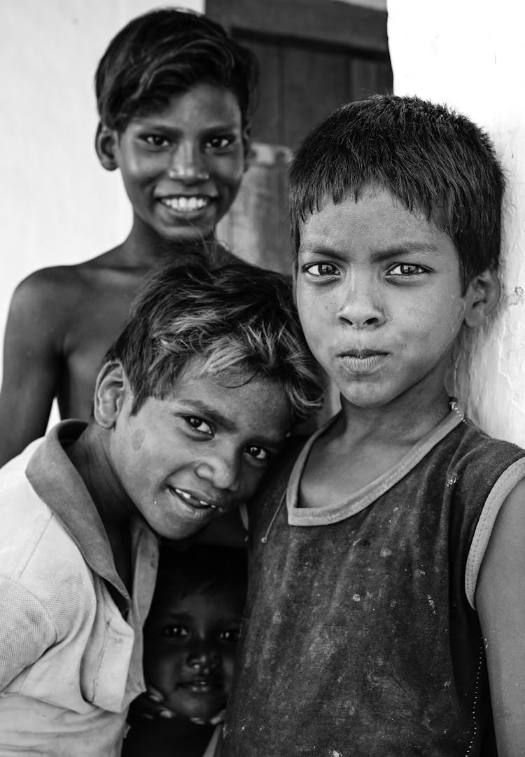 Smiling Poor Children Posing Outdoors