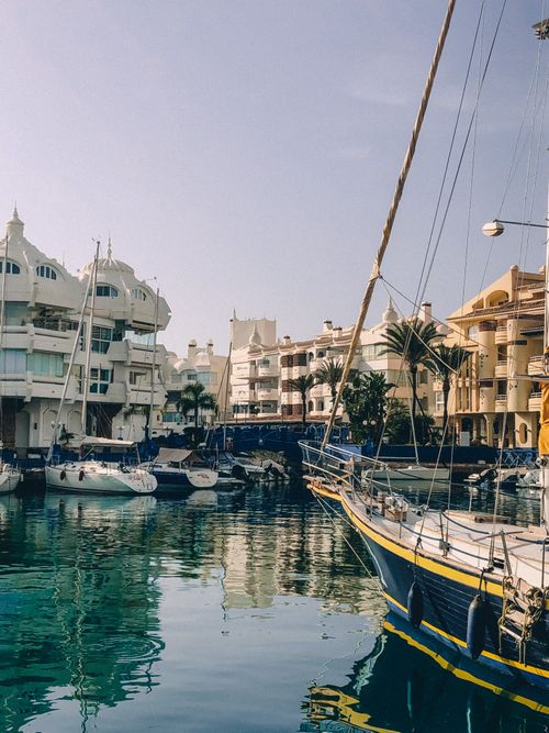 Free Picturesque marina in Benalmádena, Spain featuring moored yachts and Mediterranean architecture. Stock Photo