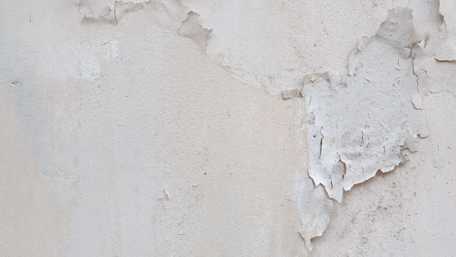 peeling paint on interior wall close up