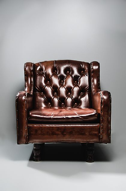 Button-tufted leather armchair, photo by Jonathan Borba on Pexels