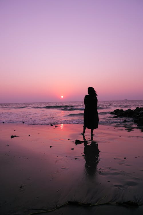 Silhouette of Woman at the Beach