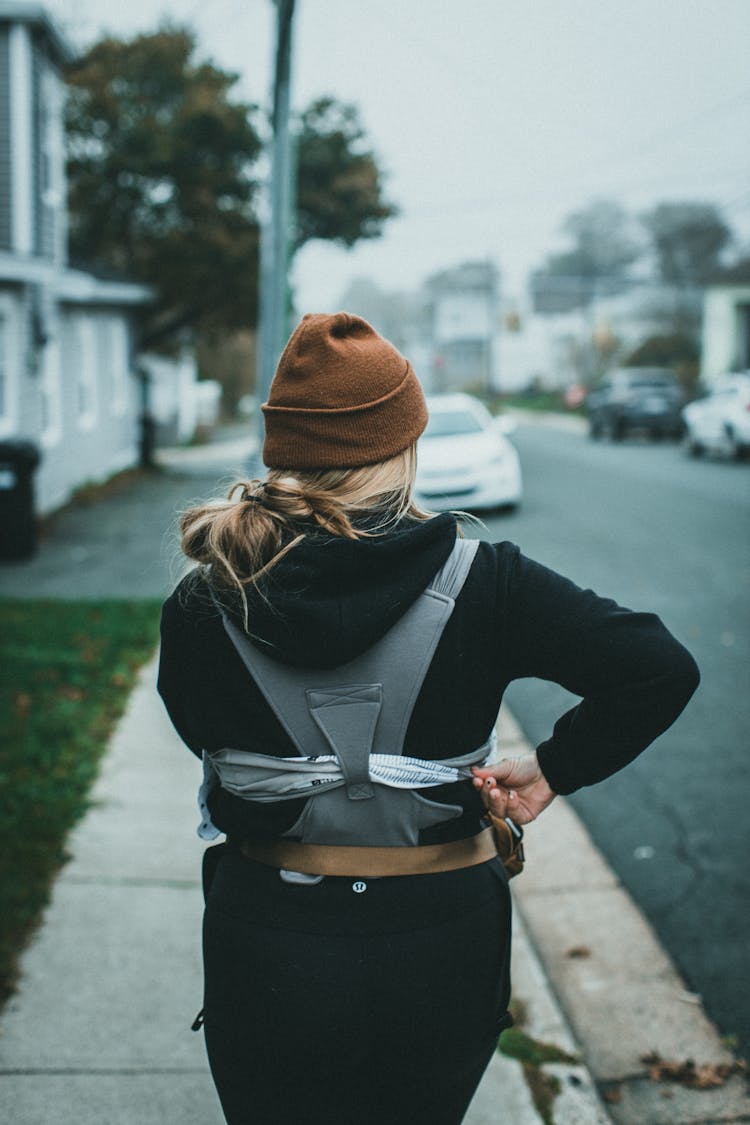 Woman On Sidewalk Near Street