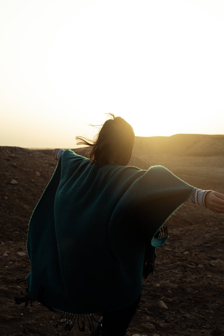 Woman Posing In Wild Nature On Sunset