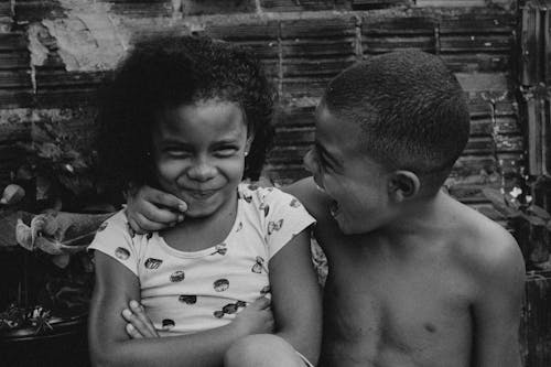 Grayscale Photo of Two Children
