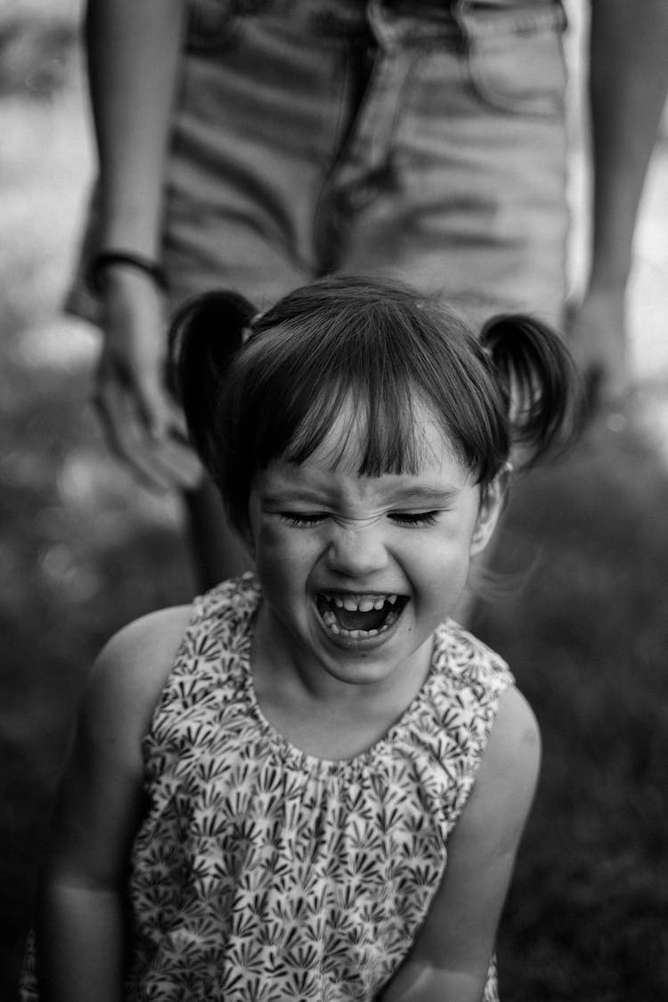 Black And White Photograph Of A Laughing Girl