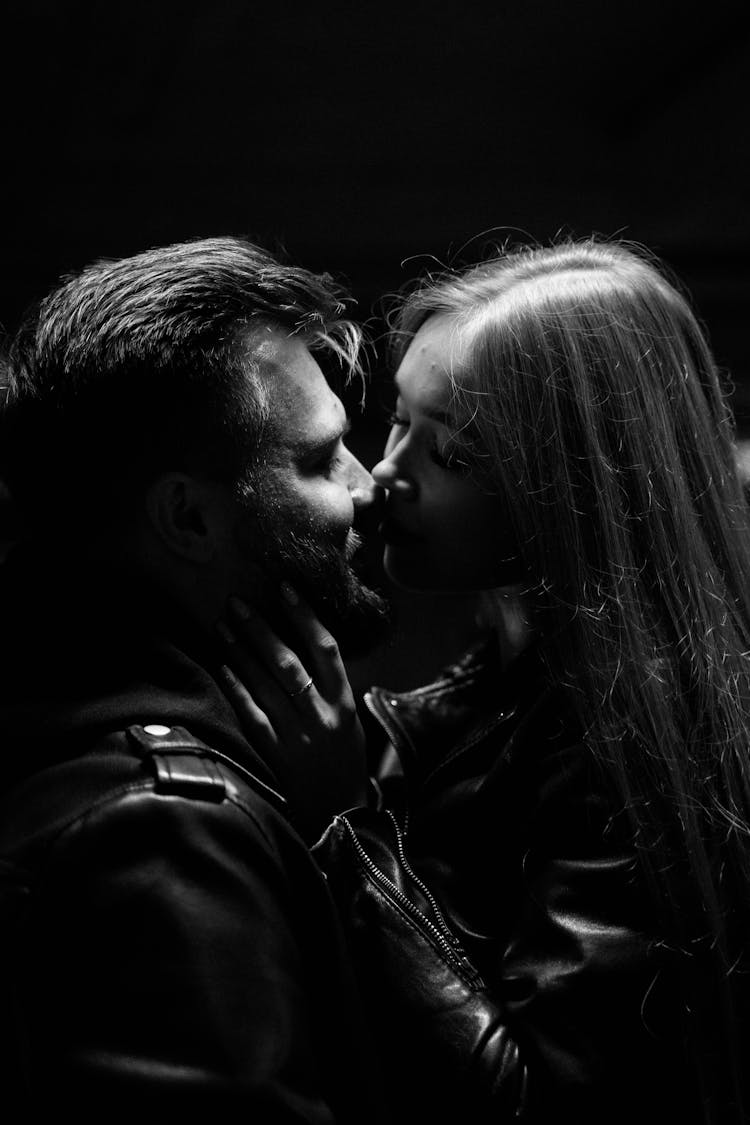 Black And White Studio Shoot Of A Couple Kissing