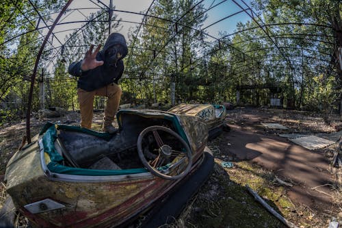 Man Standing on Top of Unused Bumpcars