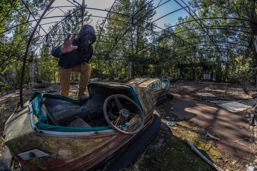 Man Standing on Top of Unused Bumpcars