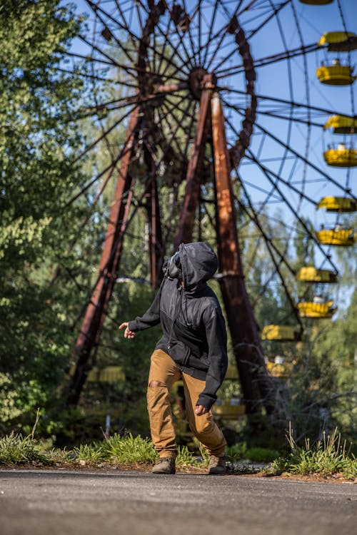 Person Standing Near Ferris Wheel