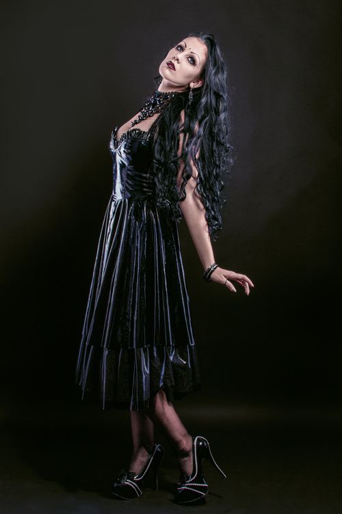 Free A stylized portrait of a woman with creative gothic makeup and attire in a studio setting. Stock Photo