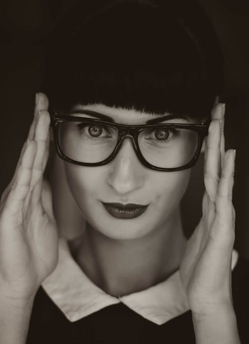 Grayscale Photography of Woman Wearing Eyeglasses