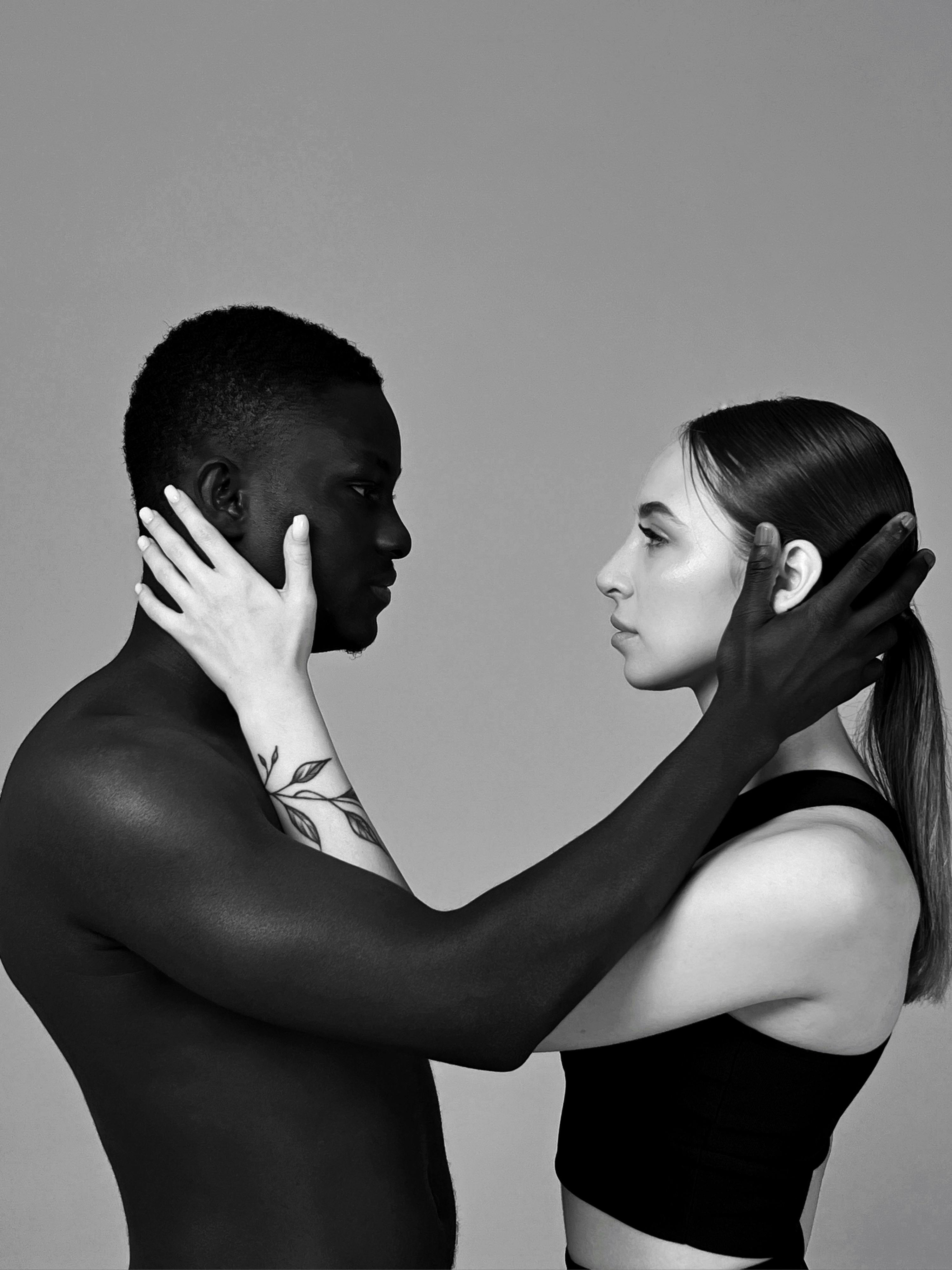 Studio Shoot of a Black Man and White Woman Embracing Each Other · Free Stock Photo picture