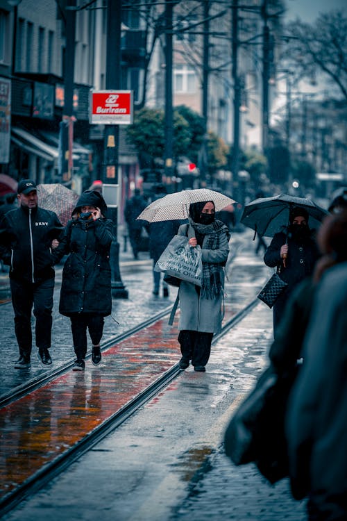 People Walking on the Street while Raining