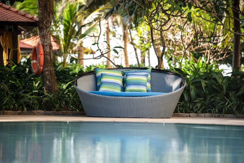 Wicker Chair with Pillows on Poolside