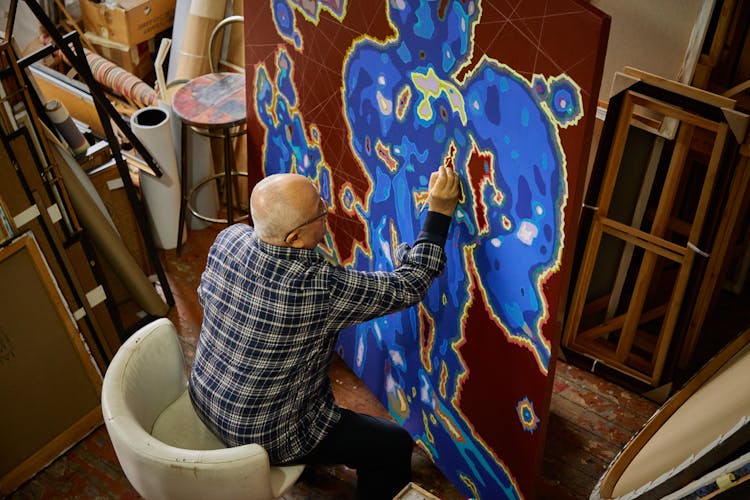 Artist Working On A Painting 