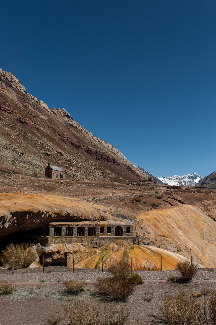 Barren Mountain Landscape With Elements Of Architecture