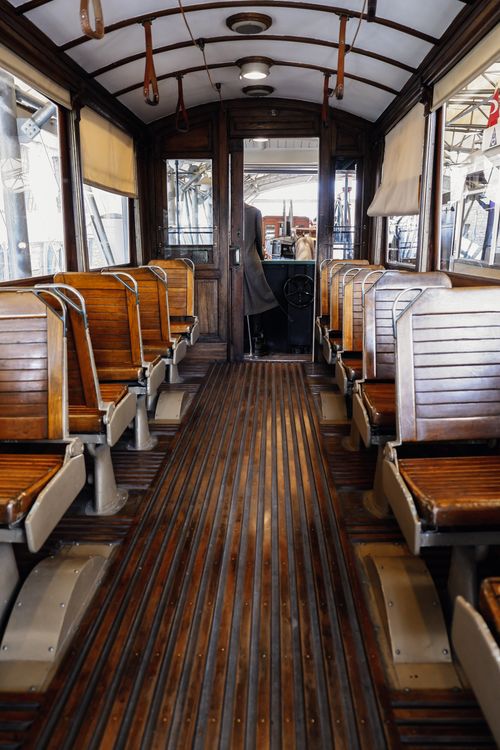 Free Interior of a vintage tram showcasing wooden seats and elegant design in Istanbul, Turkey. Stock Photo