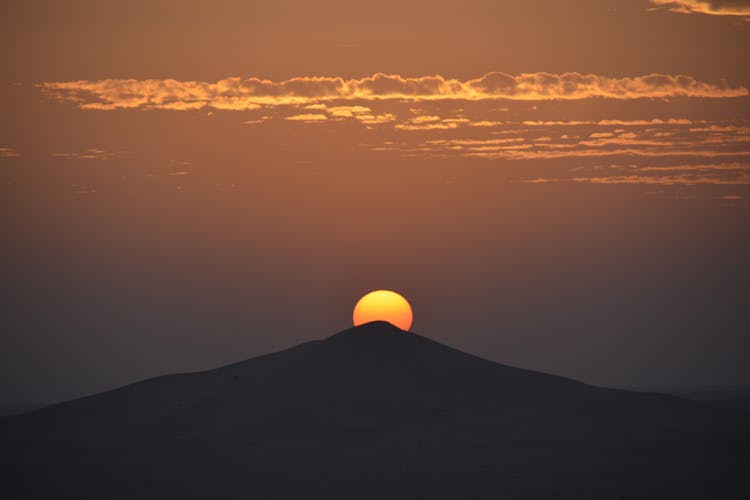 Silhouette Of Mountain During Sunset