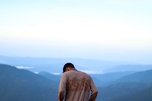 Man in Brown Long Sleeves Shirt Looking Down 