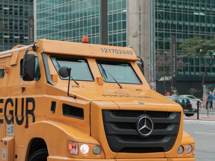 Armoured cash-in-transit vehicle parked on a city street