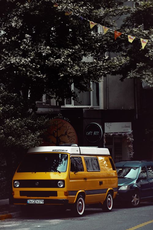Free A classic yellow Westfalia van parked on a charming street in Istanbul. Stock Photo