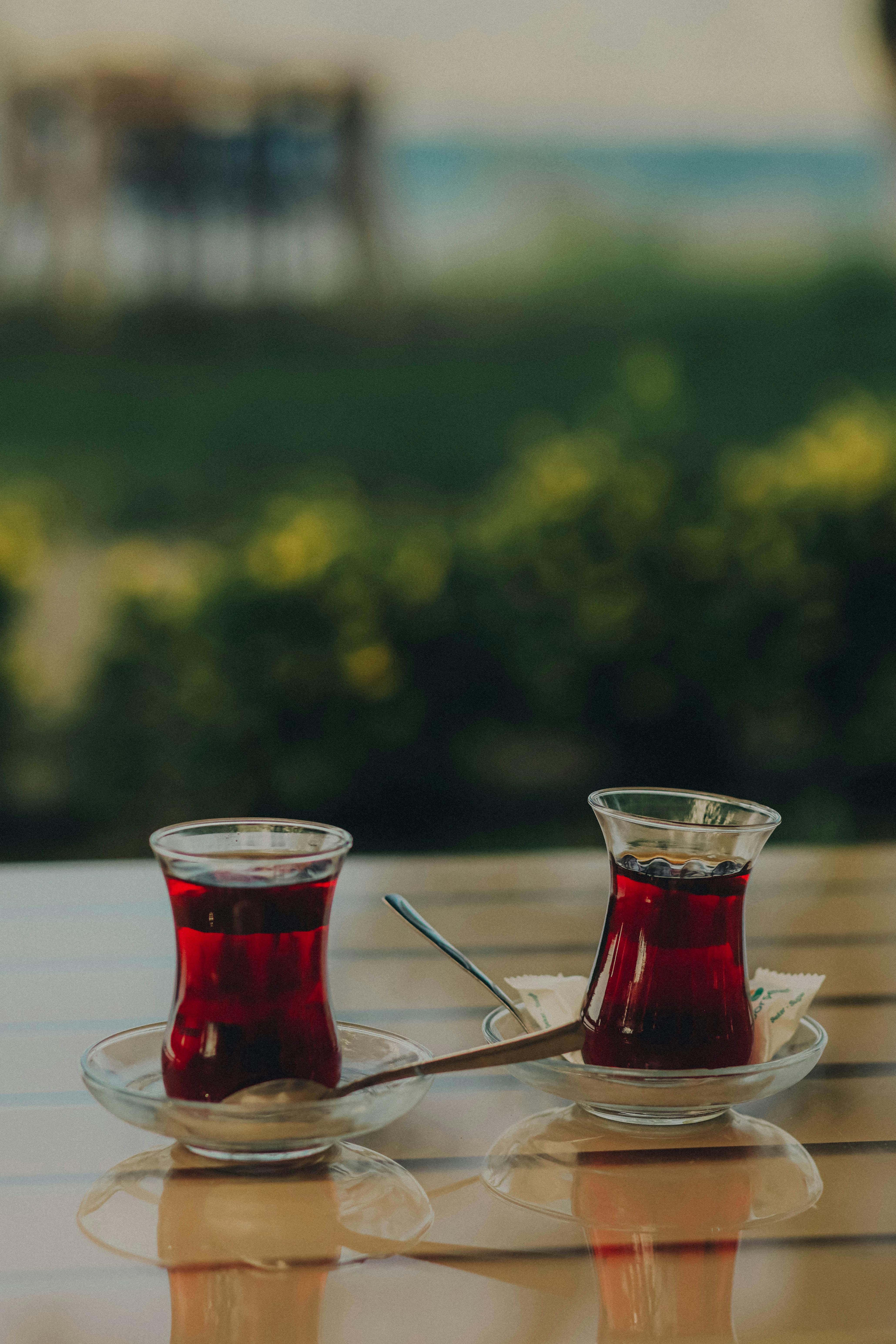Two glasses of Turkish tea on an outdoor table in Sapanca, Turkey, capturing a serene and traditional moment.