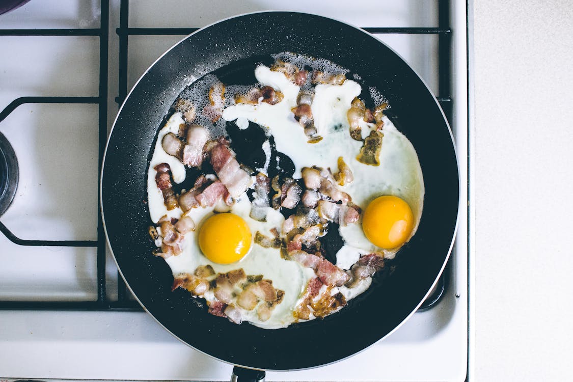 Free Eggs With Meat in Cooking Pan Stock Photo