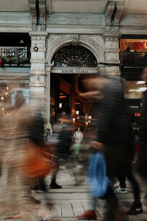 Free Blurred pedestrians outside Suriye Pasaji, capturing the bustling Istanbul street life. Stock Photo