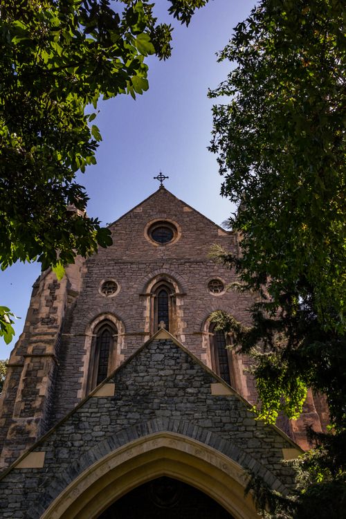 Free Low angle view of the historic Crimean Memorial Church in Istanbul, framed by lush trees. Stock Photo