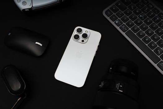 A sleek flat lay of modern tech gadgets with a smartphone and accessories on a dark background.