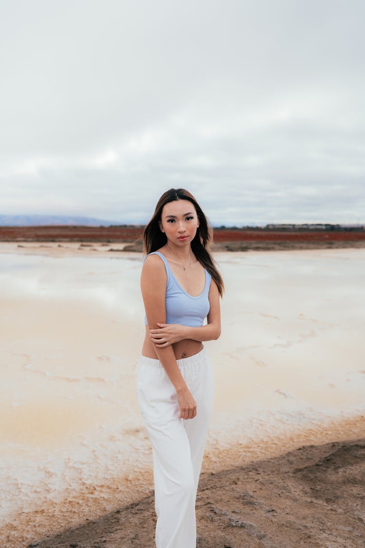 Young Beautiful Woman On The Beach 