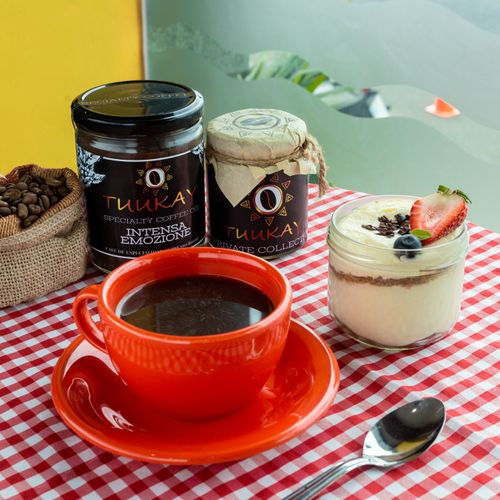 Free An inviting setup with coffee, parfait, and jars on a red checkered tablecloth. Stock Photo