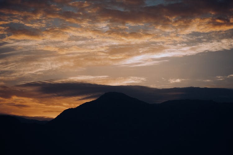 Silhouette Of Hills At Sunset