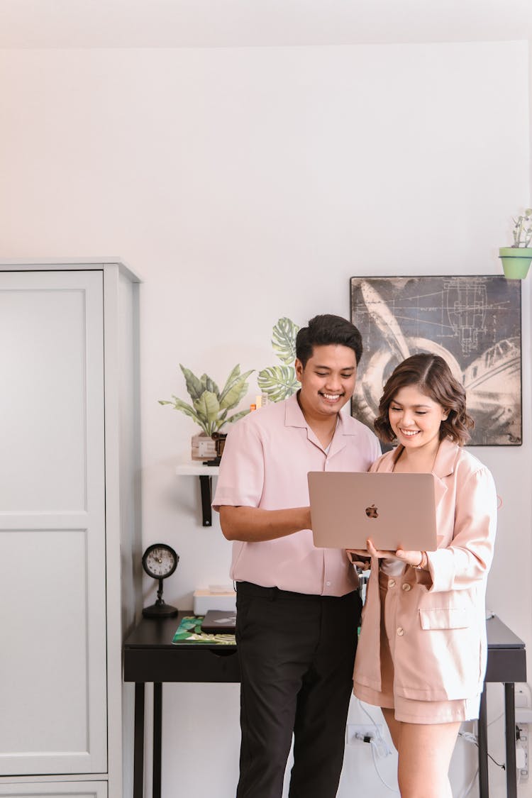 Woman And Man With Laptop