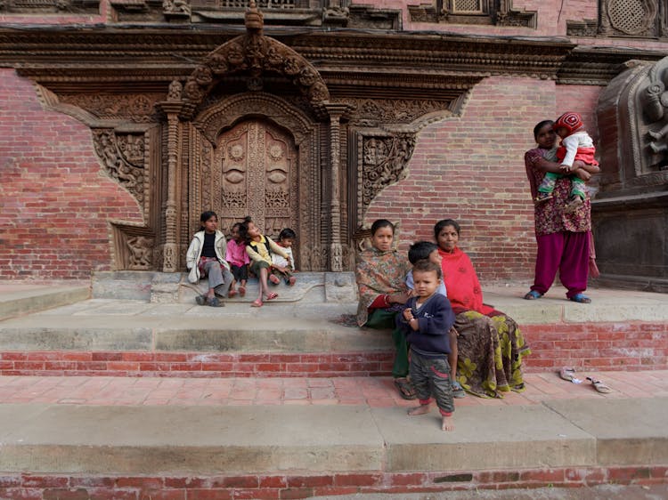 Women With Children In Traditional Clothes Near Temple