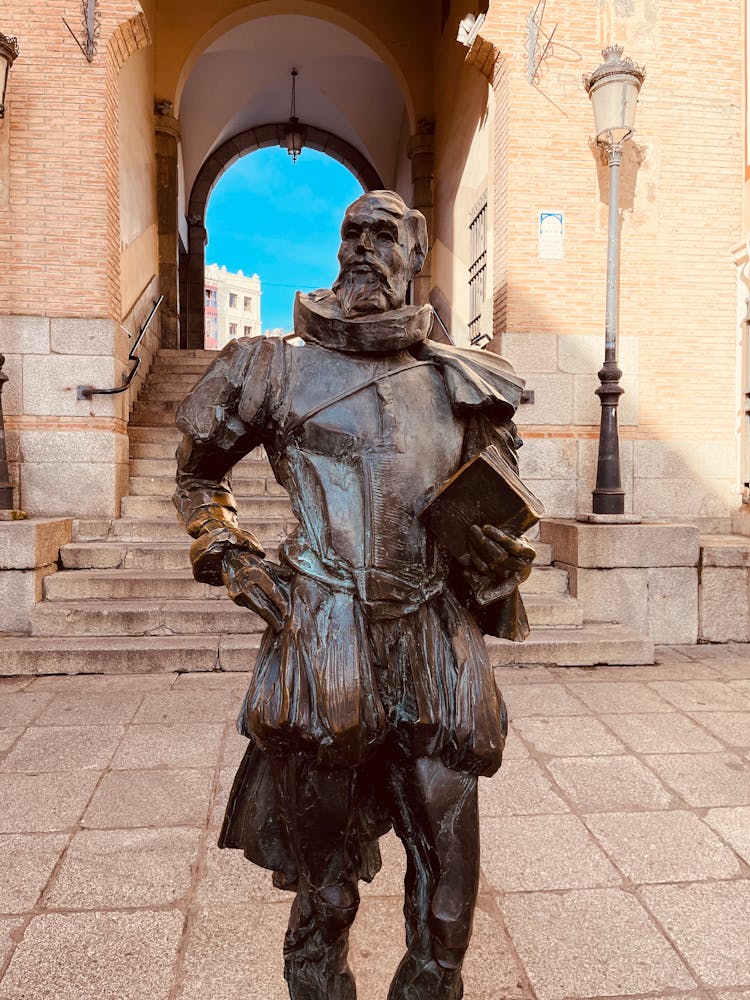 Sculpture Of Man With Book