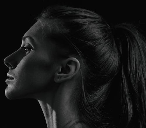 Grayscale Photo of a Woman With Ponytail 