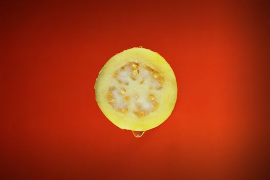 Sliced Guava Fruit On Red Surface
