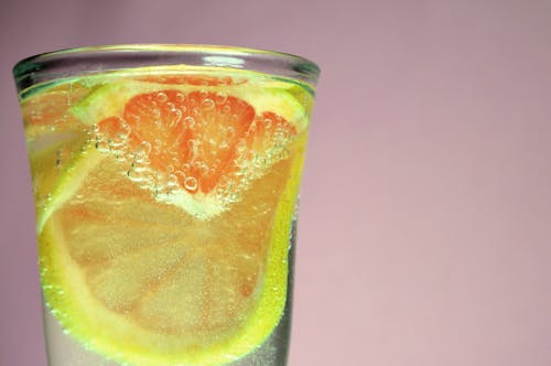 免费 柑橘饮料的选择性摄影 素材图片