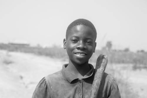 Smiling Boy in Black and White