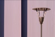 Steel Lamp Against Metal Wall with Stripes
