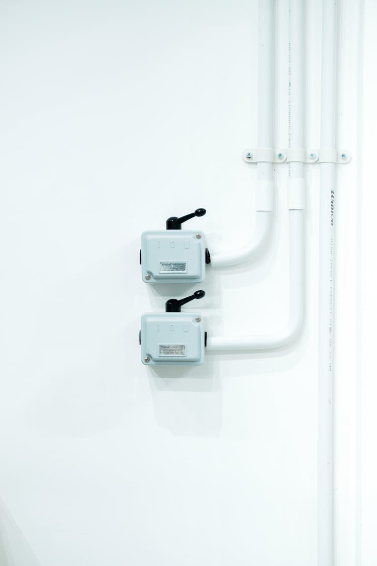 Electric Switches  Mounted On White Wall