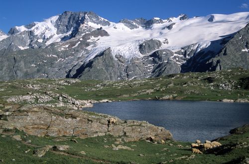 Free Beautiful alpine scene with lake and mountains in La Grave, France. Stock Photo