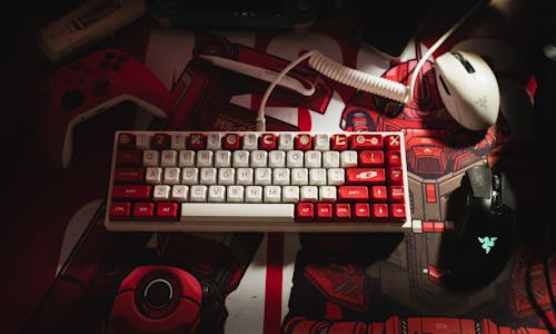 White and Red Computer Keyboard in Close Up Shot