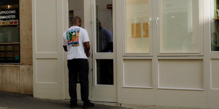 Man Closing A Door