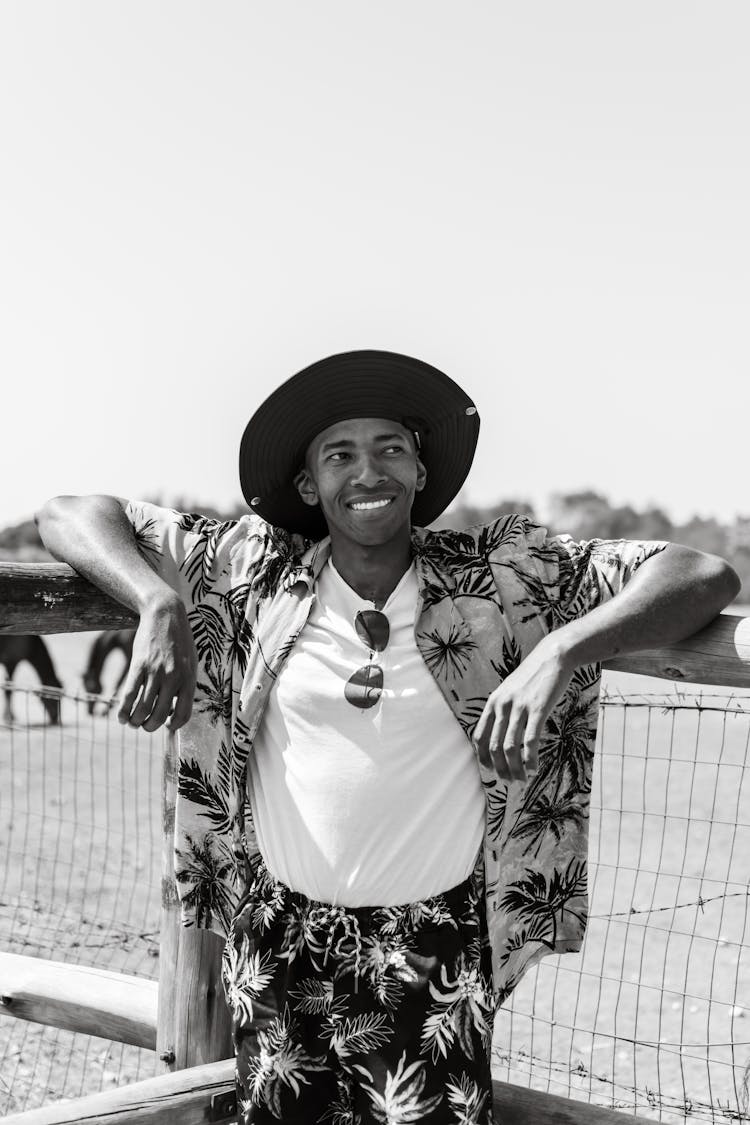 Smiling Man In Hat In Black And White