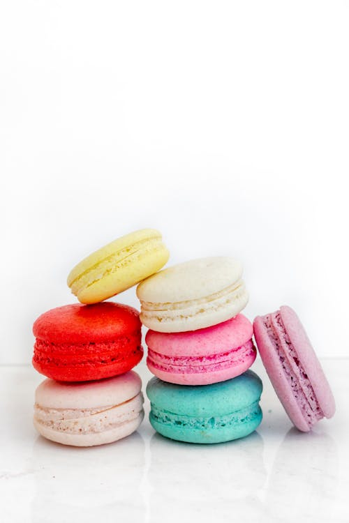 Colorful Macarons on a White Surface