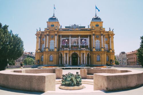 Free Majestic Baroque theater building in urban setting with ornate architecture. Stock Photo
